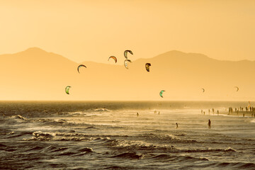 Fototapete - Kitesurfing Activity at Barra da Tijuca Beach on Sunset in Rio de Janeiro, Brazil