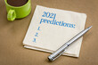 2021 predictions list - handwriting on a napkin with a cup of coffee, business and financial trends, expectations and speculations for  the New Year