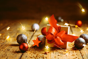 Wall Mural - christmas still life - retro look - xmas decoration, gift box with red bow, balls and ornaments on r