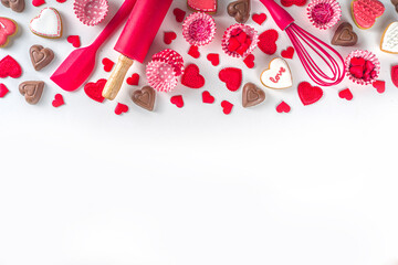 Wall Mural - Valentine day cooking baking background. Utensils and ingredient for sweet Valentine cakes and heart shaped cookies, white background top view copy space