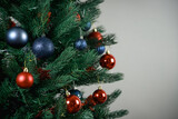 Fototapeta Londyn - Decorated Christmas tree. Blue and red balloons, Christmas toys.