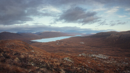 Magnificent panorama of mountain valley and lake. View from The Devils Staircase to Blackwater Reservoir and Blakwater Dam. Highlands, Scotland