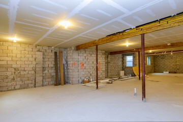 Canvas Print - New house under construction home framing with basement unfinished view