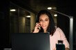 © David Prado/Stocksy - Cheerful young businesswoman speaking on smartphone