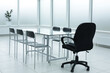 © Qwenergy - Black chairs glass table in office space