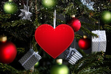 Christmas Background With Red Heart Card, Christmas Tree, Green Bauble And Gifts.