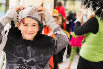 Portrait of smiling Caucasian boy in mummy costume