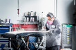 © Sollina Images/Blend Images - Hispanic mechanic working in auto shop