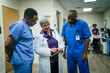 © FS Productions/Blend Images - Doctor and nurses discussing digital tablet