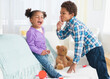 © JGI/Jamie Grill/Blend Images - Black children playing on sofa