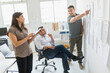 © JGI/Tom Grill/Blend Images - Hispanic business people working together in office
