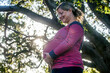 © Adam Hester/Blend Images - Low angle view of pregnant Caucasian mother holding her stomach outdoors
