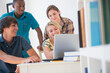 © JGI/Jamie Grill/Blend Images - Teenagers using laptop at desk