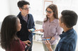 © JGI/Tom Grill/Blend Images - Business people working together in office with technology