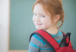 © JGI/Jamie Grill/Blend Images - Caucasian girl wearing backpack in classroom