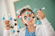 © JGI/Jamie Grill/Blend Images - Girl examining molecular model in science class