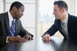 © JGI/Jamie Grill/Blend Images - Businessmen talking in office meeting