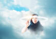 © JGI/Tom Grill/Blend Images - Mixed race businesswoman in clouds