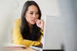 © JGI/Jamie Grill/Blend Images - Chinese businesswoman using laptop