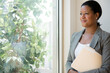 © JGI/Jamie Grill/Blend Images - Black businesswoman looking out window