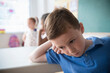 © JGI/Jamie Grill/Blend Images - Sad student leaning on desk