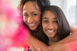 © JGI/Jamie Grill/Blend Images - Smiling mother and daughter hugging
