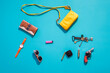 © Aliyev Alexei Sergeevich/Blend Images - Purse, wallet, gun and accessories on blue background