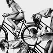 © Aliyev Alexei Sergeevich/Blend Images - Multiple exposure of Caucasian girl riding bicycle