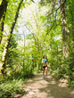 © Erik Isakson/Tetra Images - Young woman jogging in forest