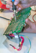 © Dmitriy - Repair and soldering of uninterruptible power supply.