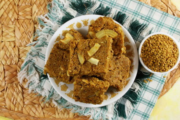 indian gujarati traditional healthy sweet for winter immunity methi pak or methi ladoo made from butter,fenugreek,dry fruit and other spices