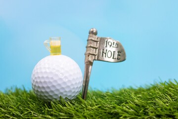 Wall Mural - Golf 19th Hole on green grass with blue sky background