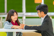 © shine - Two young asian students campus helps friend catching up and learning tutoring.