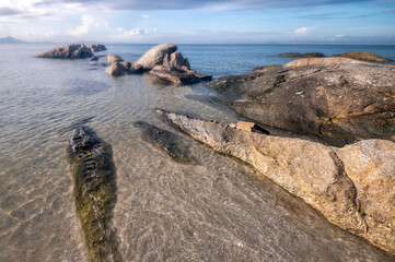 Wall Mural - The rock on the beach with daylight