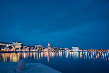 Wall Mural - Travel by Croatia. Beautiful landscape with Split Old Town on sea shore at night.