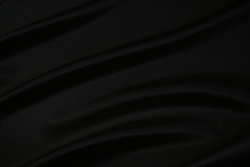 Wall Mural - Black silk satin fabric background. Black elegant background. Shiny fabric with wavy folds.