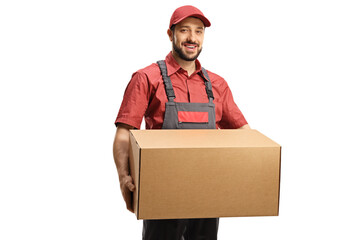 Wall Mural - Male worker in a uniform holding a cardboard box and looking at camera