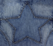 Blue Jeans Texture With Seam In Star Shape. Copy Space Background.