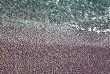 Artificial Pebble Beach Background Top View. Isolated Background Of Sea Beach With Diagonal Line Separating Claim Ocean Sea Lake Water. Shingle Beach Abstract  Empty Background Of Claim Water Texture 