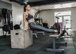 © splitov27 - Young athletic woman practicing reverse push-ups on triceps on benches in gym