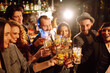 © maxbelchenko - Group of friends cheering and drinking cocktails together at the bar. Young people celebrating winter holiday together with coctails at a nightclub party. Youth, lifestyle, drink, birthday concept.