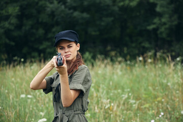 Wall Mural - Woman soldier looking ahead weapon hunting weapons 