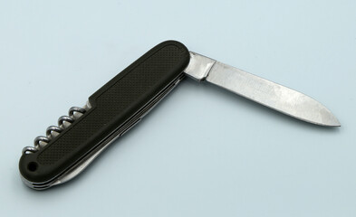 Wall Mural - folding knife on gray background