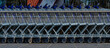 © blende11.photo - A row of shopping carts in front of a supermarket