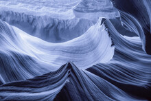 Blue Cast Color On The Wavy Rocks In A Canyon