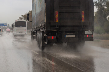 Truck moving fast in the rain