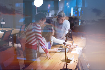 Wall Mural - Meeting of co-workers and planning next steps of work. Young business group in discussion in their office. Startup people working in office.