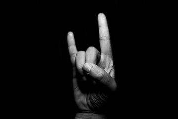 Sign language against black background