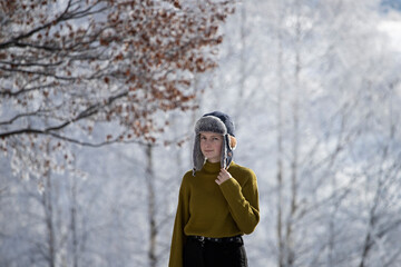 Young girl in fairytale winter landscape.