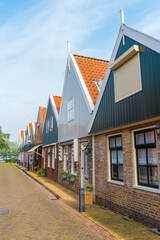 Wall Mural - Volendam is a town in North Holland in the Netherlands. Colored houses of marine park in Volendam.